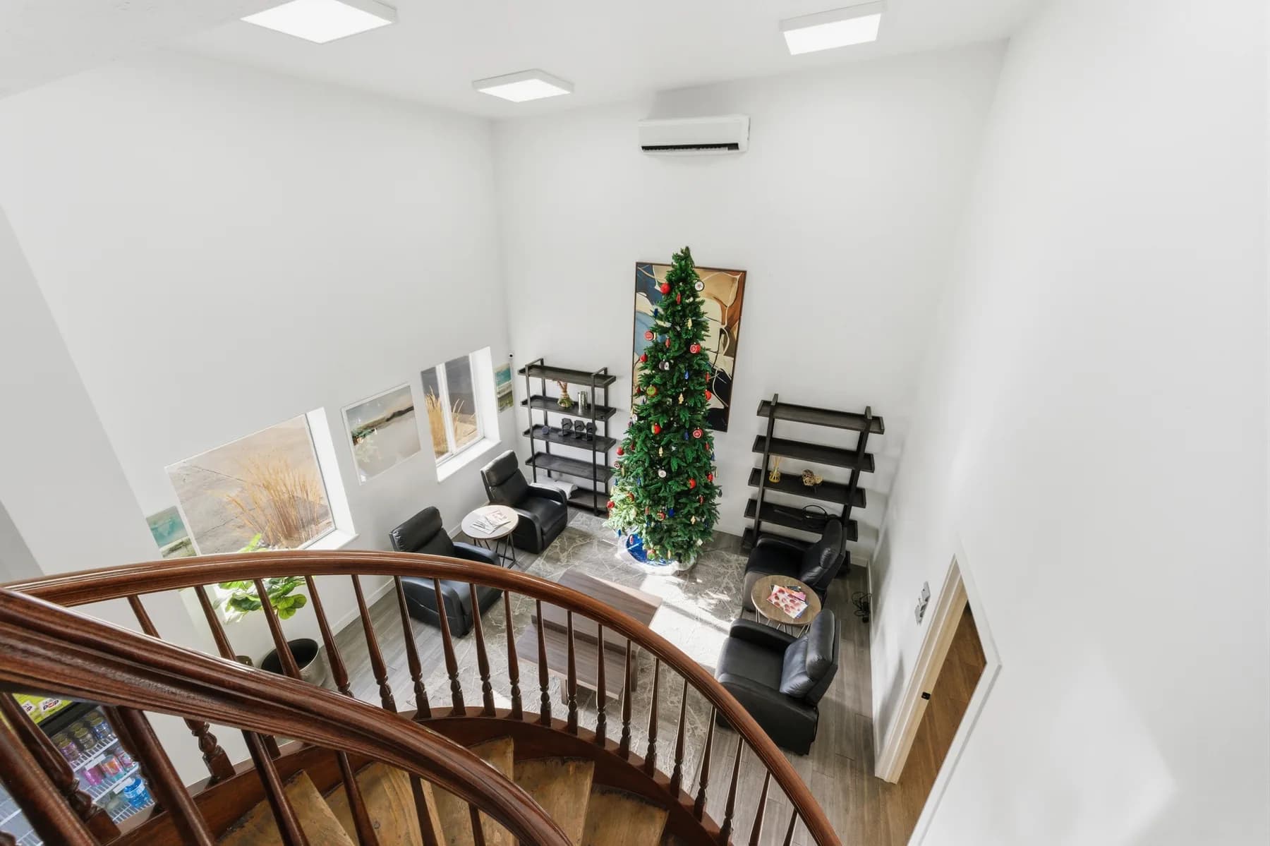 Upper landing overlooking the curved wooden staircase