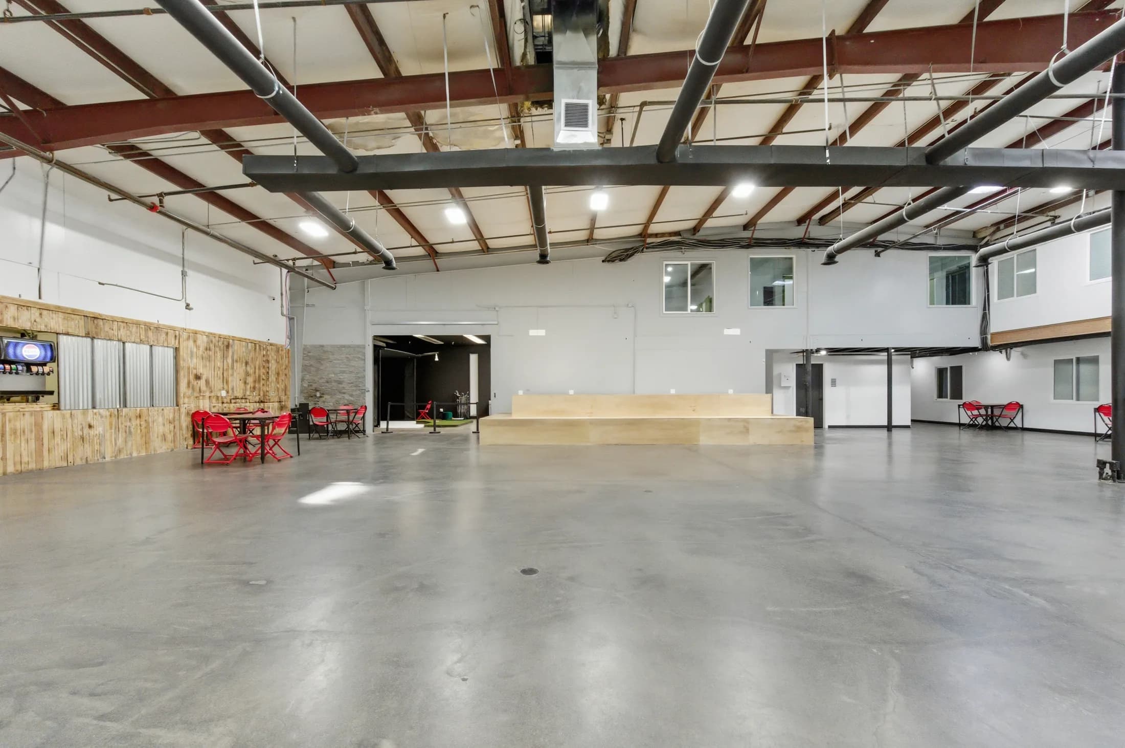 Open floor and stage inside The Arena