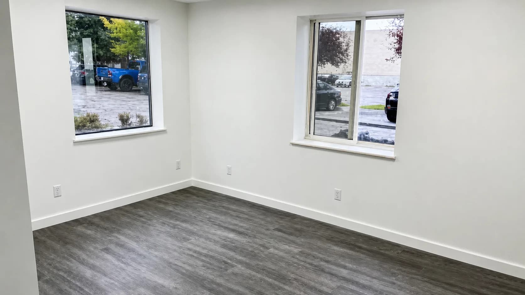An unfurnished private office inside The Anata Building